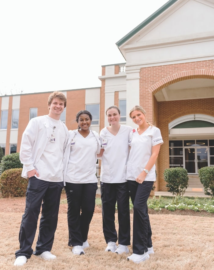 Four nursing students outside of the Dublin campus building